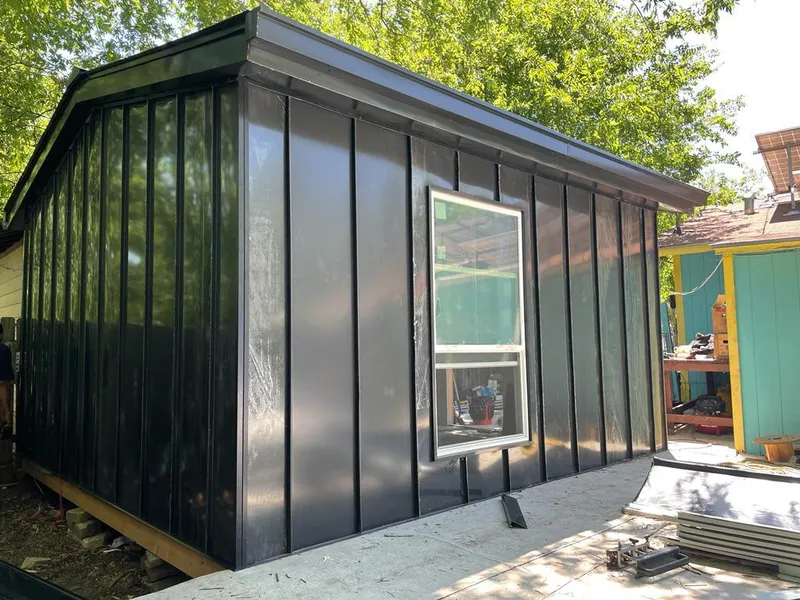 Black standing seam metal wall panels for Roof Inspection in Southaven