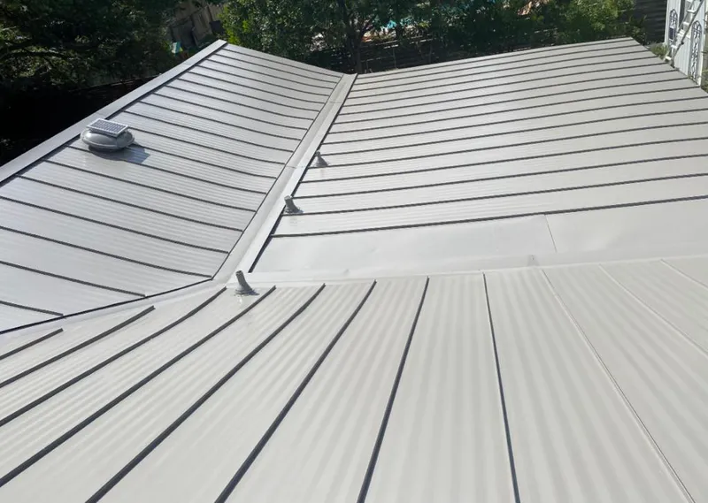 Solar attic fan installed on a metal roof for Roof Ventilation in Southaven